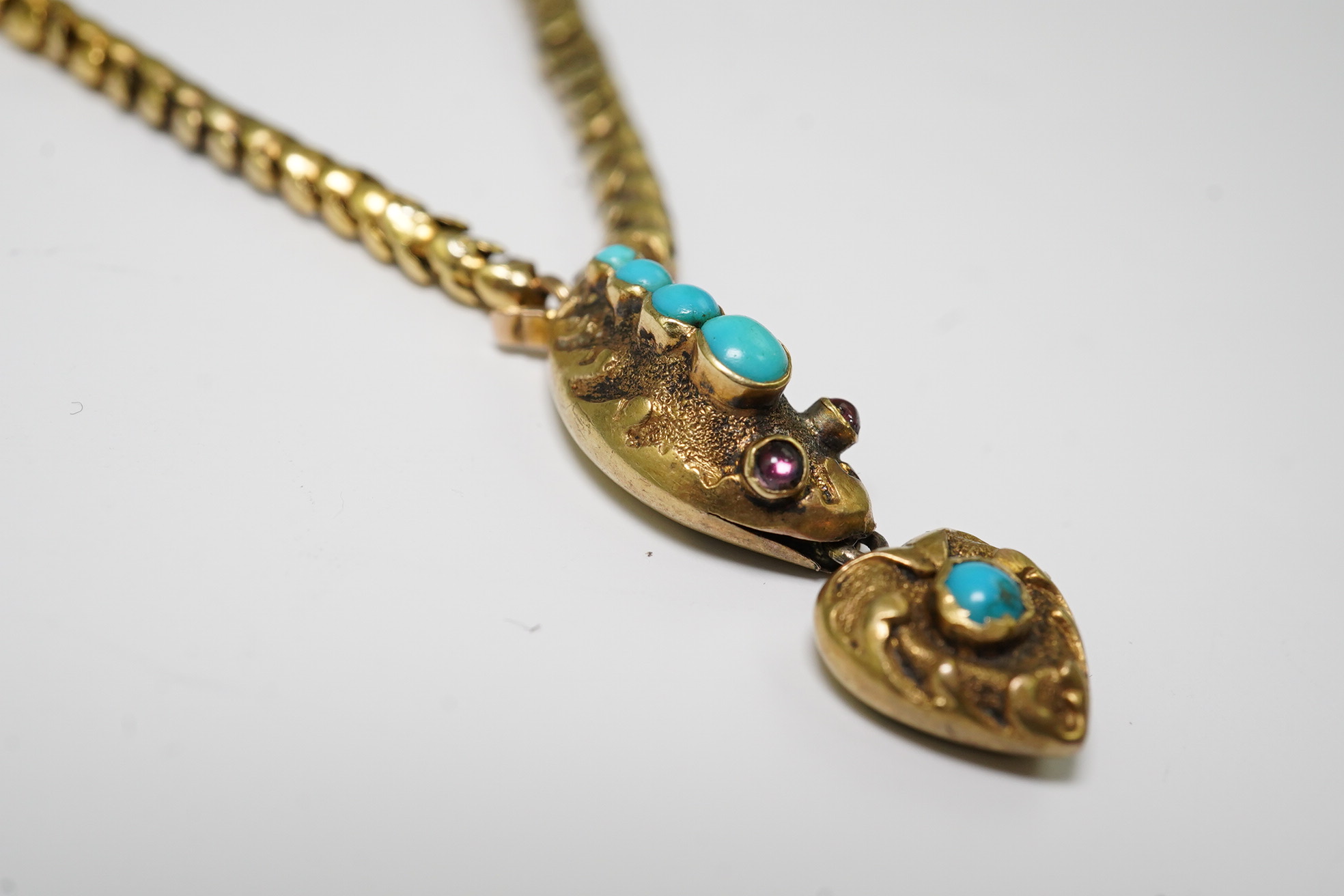 A Victorian gold, turquoise and cabochon garnet set serpent necklace